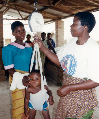 Malawi Chipini Weighing a child