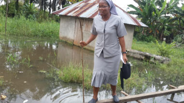 Nigeria Franca Maduike visiting Torugbene peak rainy season community submerged