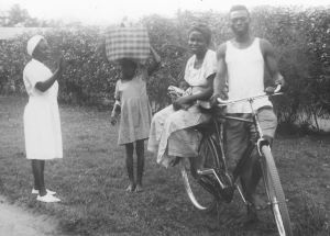 Image 2 WA 149 A nurse sees off happy parents going home with a new baby The attendant carries the luggage and mother and baby ride resized