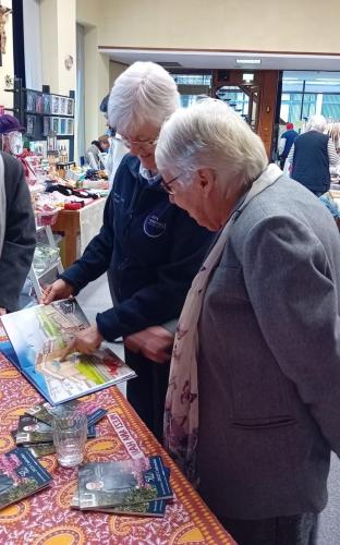 Srs. Dervilla O'Donnell and Rita Kelly, MMM, looking at the new Mother Mary book