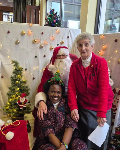 Sr Agatha Bakahirwa, MMM and Sr. Catherine Fallon, MMM with Santa