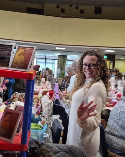 Caoimhe Hughes, MMM Communications Office Manager behind one of the stalls.